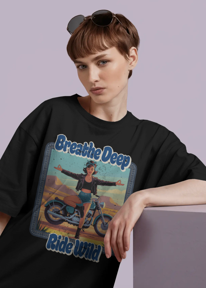 Person wearing a black t-shirt with a graphic design and text on a plain background