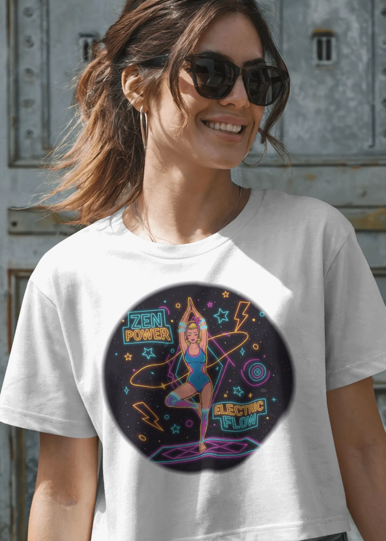 Woman wearing a white t-shirt with a colorful graphic design in front of a textured wall.