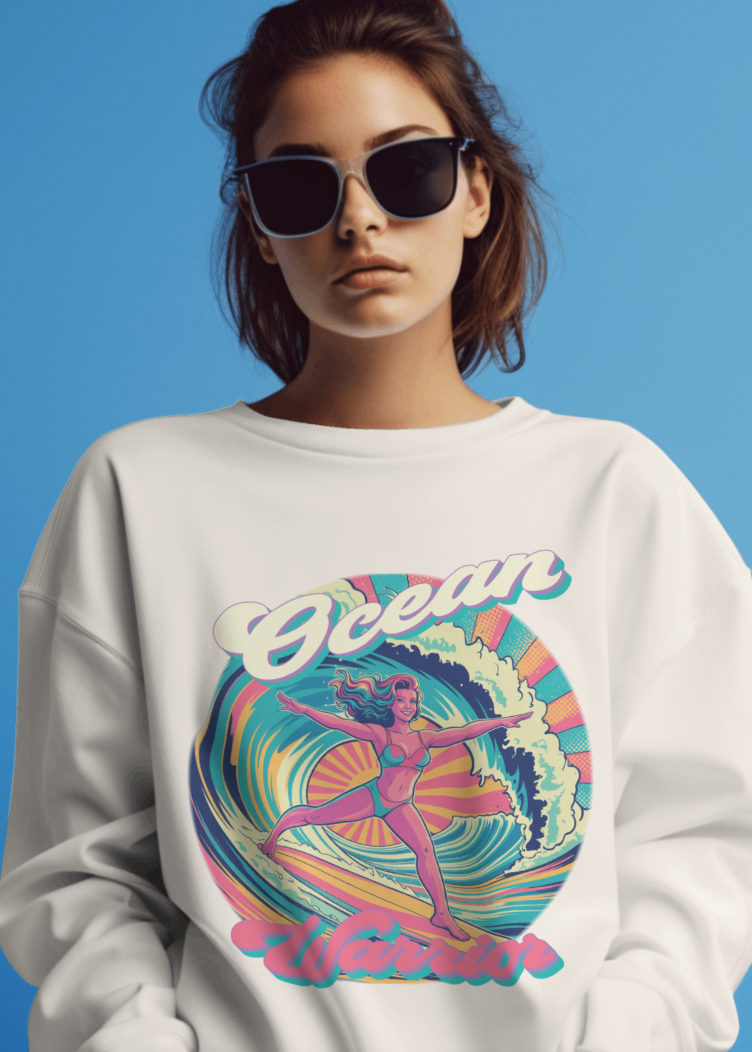 Person wearing a white sweatshirt with a colorful 'Ocean' design on a blue background