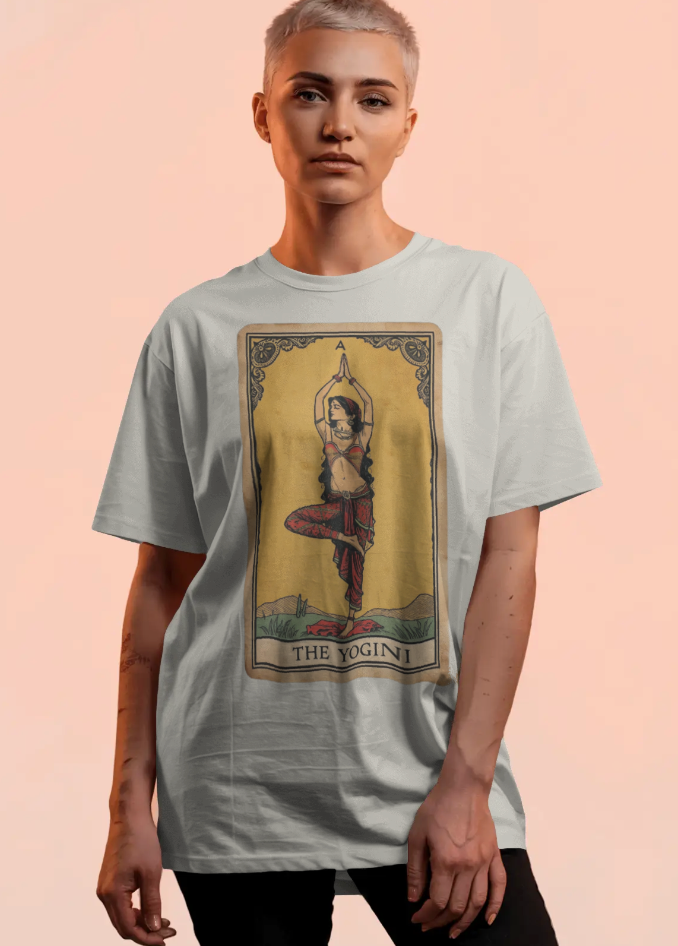 Person wearing a t-shirt with a graphic design of a tarot card featuring a woman in a yoga pose.