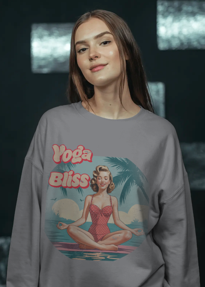 Person wearing a gray sweatshirt with 'Yoga Bliss' design featuring a woman in a swimsuit.