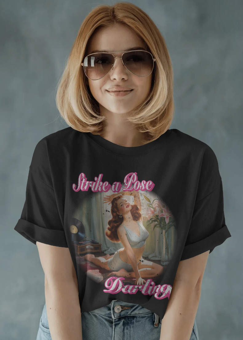 Person wearing a black t-shirt with a graphic design and text.