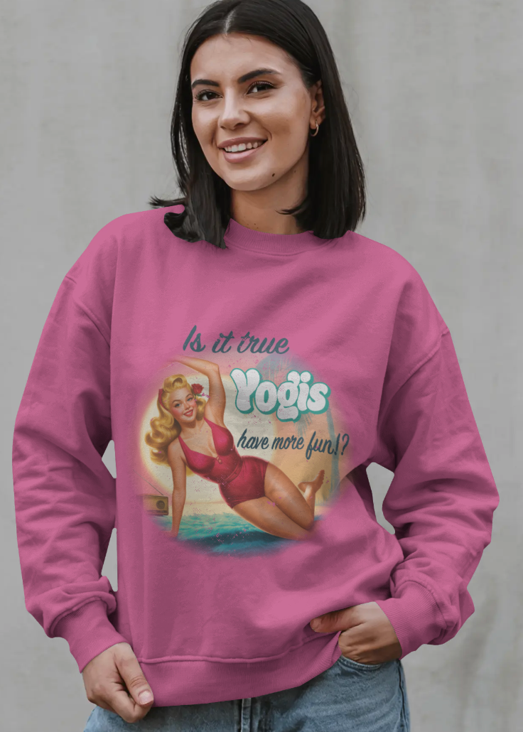 Woman wearing a pink sweatshirt with a graphic design and text on a plain background